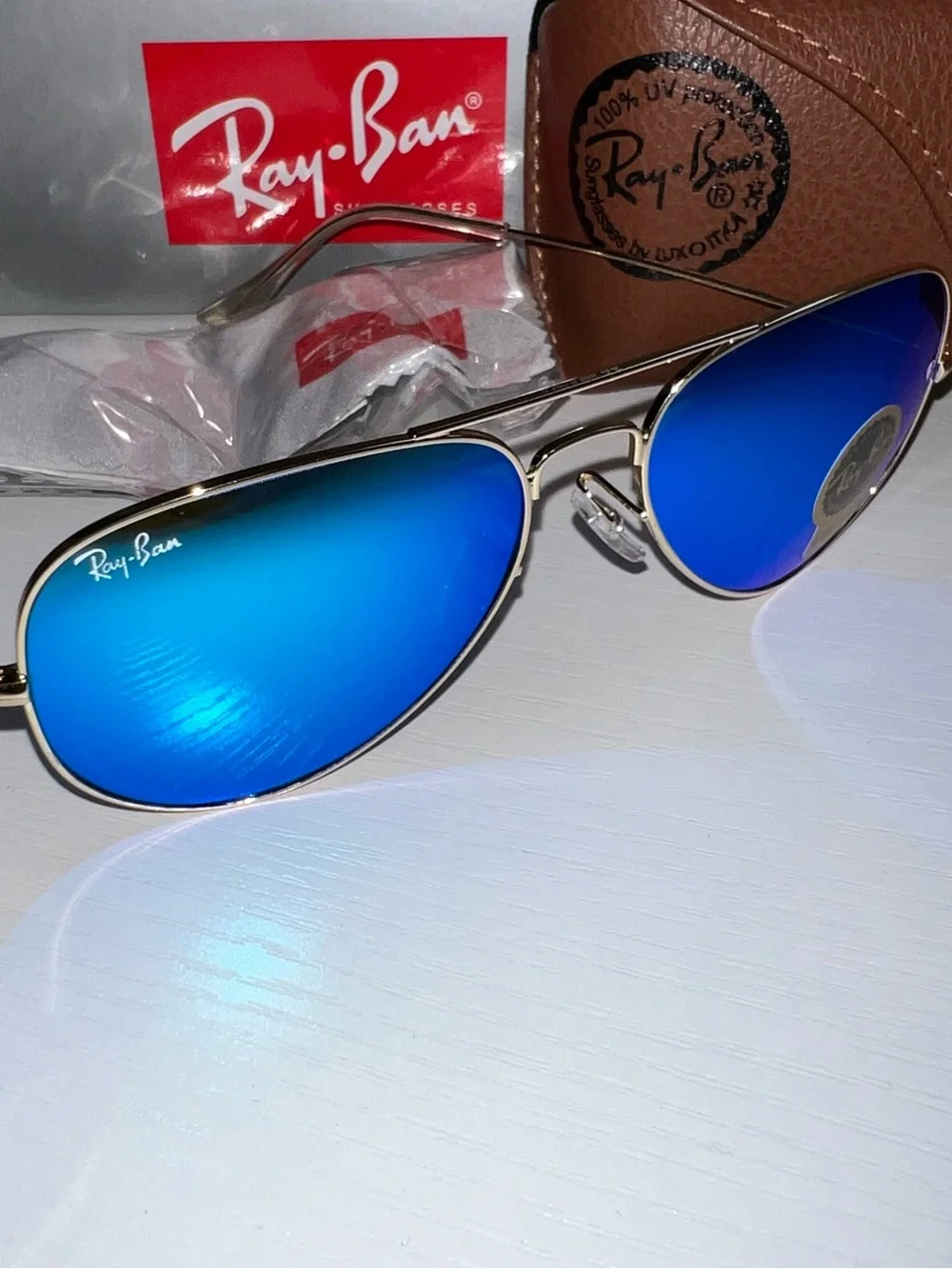 Ray-Ban Gold Frame Sunglasses with Blue Mirrored Lenses